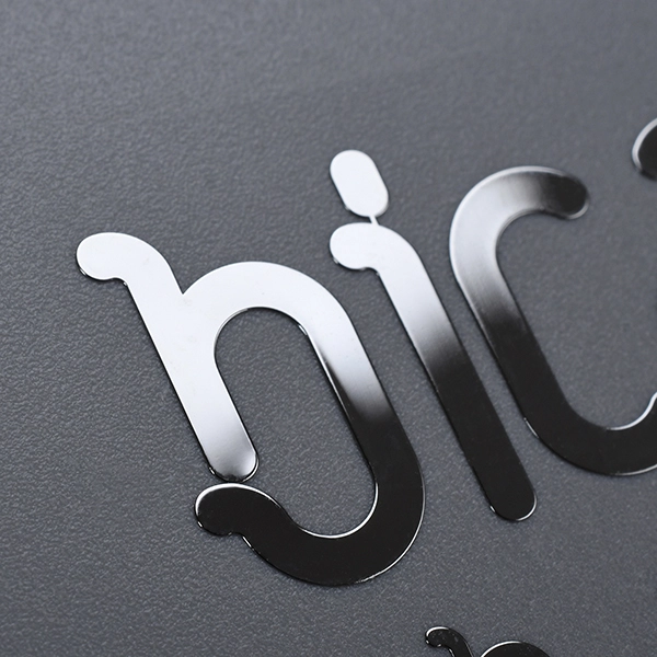 Autocollant de logo en nickel pour machine