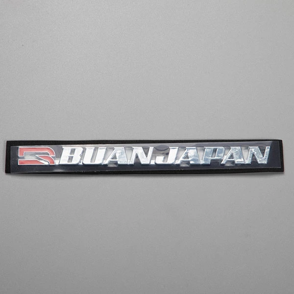 Autocollant ABS avec logo chromé