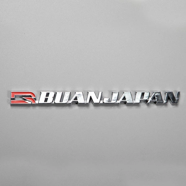 Autocollant ABS avec logo chromé