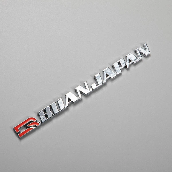 Autocollant ABS avec logo chromé