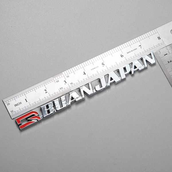 Autocollant ABS avec logo chromé