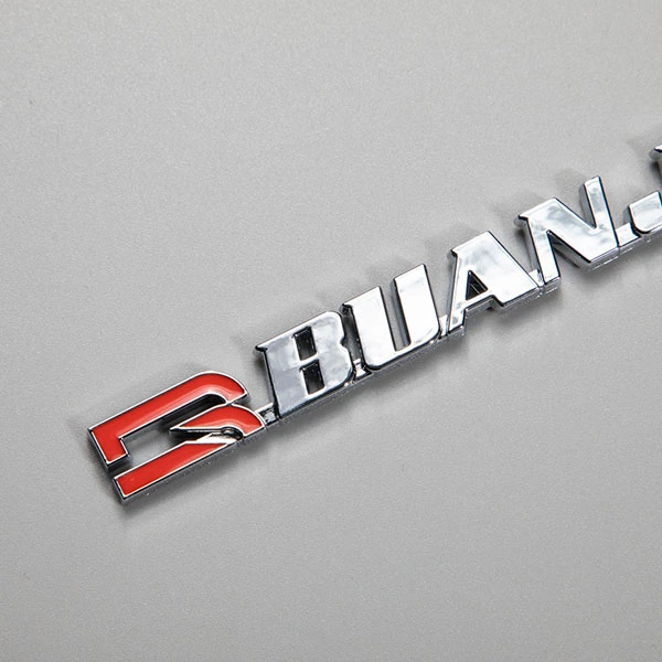 Autocollant ABS avec logo chromé