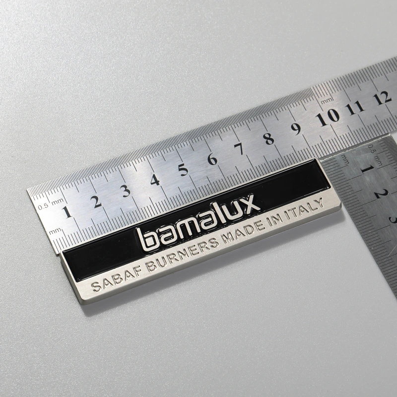 Badge en zinc chromé pour machine à laver
